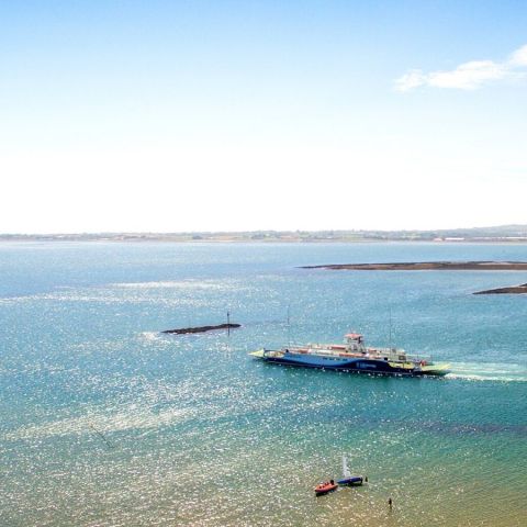 a small boat in a large body of water