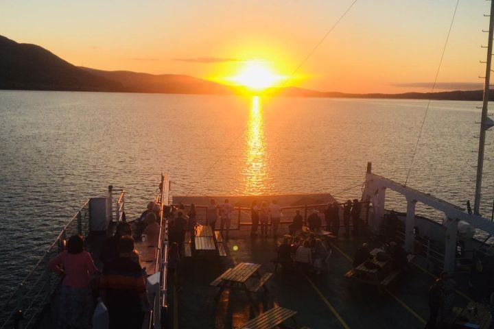 a boat is docked next to a body of water