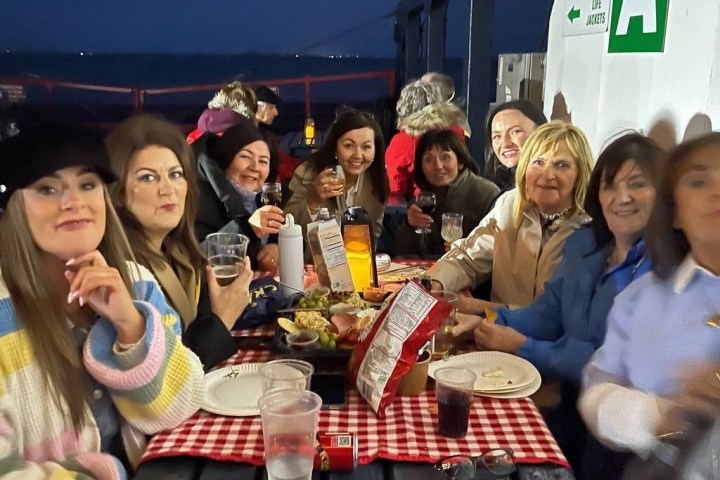 a group of people sitting posing for the camera